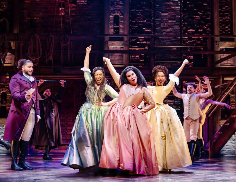 Billy Nevers as Aaron Burr, Casey Al-Shaqsy as Eliza Hamilton, Chastity Crisp as Angelica Schuyler and Naomi Katiyo as Peggy Schuyler